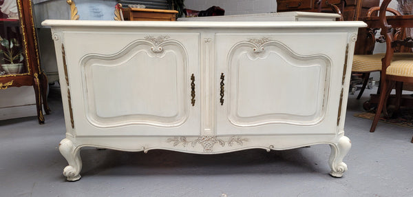 Louis XV style chalk painted two door cabinet which would also make an ideal TV cabinet. It has been sourced from France and in good original detailed condition.