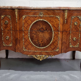 Stunning Louis XV style ormolu and marquetry marble top commode with two drawers. It has an amazing thick marble top and it is in good original detailed condition.