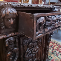 Beautifully carved French Oak early 19th century pedestal desk with 3 drawers, two cupboards and a secret cupboard on the side. There is also a lovely burgundy tooled leather top. In good original detailed condition.
