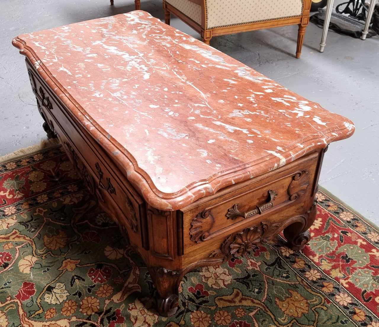 Amazing original walnut Louis XV style coffee table with a marble top, one drawer on either end and a faux drawer at the front. In good original detailed condition, sourced in France.