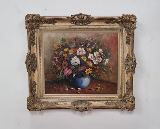 A beautiful sourced in France Floral oil on canvas in an ornate decorative frame. In good original detailed condition.