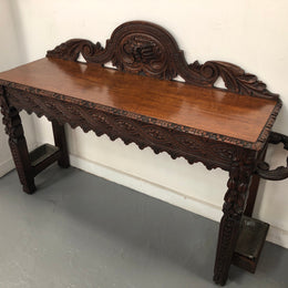 Superb 19th Century Gothic style hall/console table. It has umbrella and walking stick holders on both sides. In good original detailed condition.
