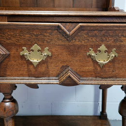 Lovely Antique Oak Tudor style kitchen dresser base with three deep drawers and lovely hardware. In good original detailed condition. There is also a dresser top with three shelves for display purposes. This piece can be purchased with or without top Price is the same either way.
