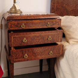 French Art Deco bedroom suite consisting of queen size bed in Amboyna wood and featuring pretty inlay. It comes with a matching pair of bedsides. It is a very stylish and high quality suite. It has been sourced from France and is in good original detailed condition.