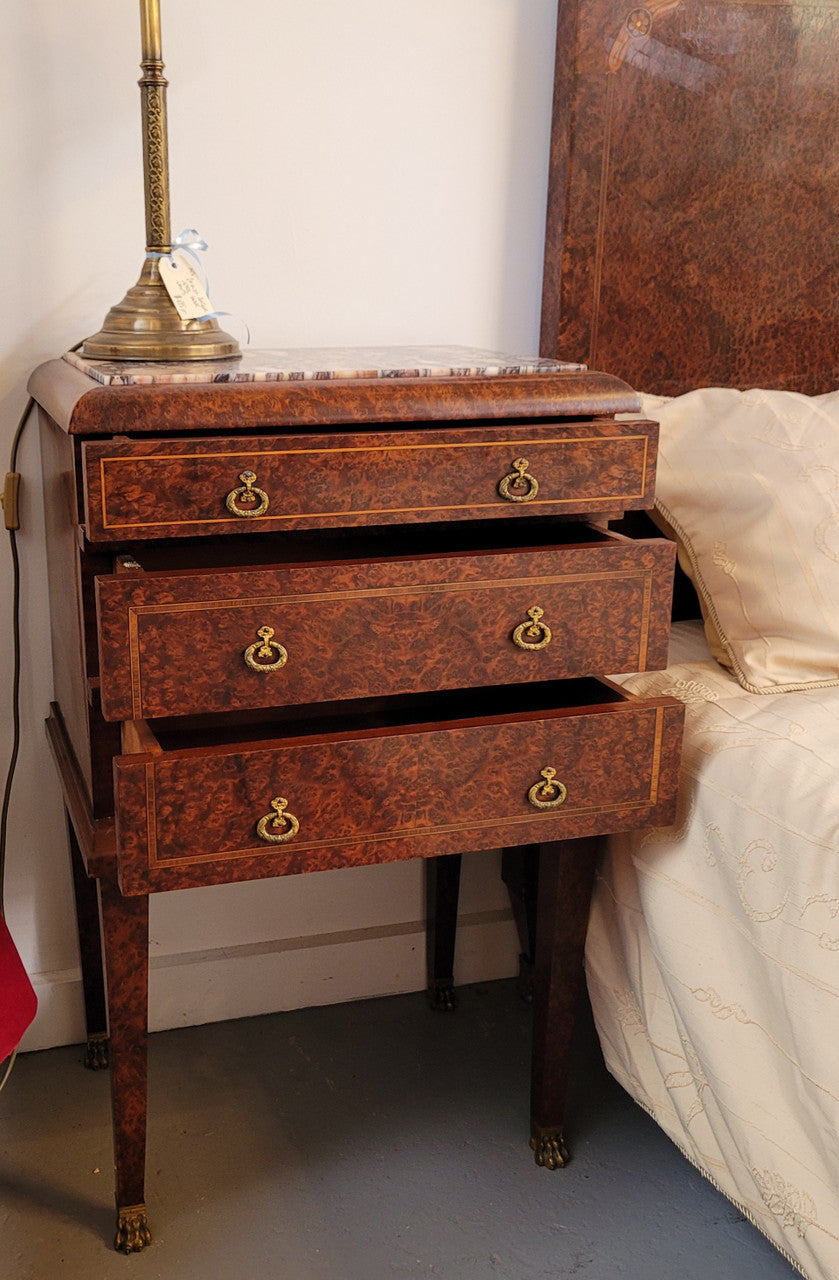 French Art Deco bedroom suite consisting of queen size bed in Amboyna wood and featuring pretty inlay. It comes with a matching pair of bedsides. It is a very stylish and high quality suite. It has been sourced from France and is in good original detailed condition.
