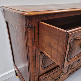 French Provincial Oak three drawer wooden top commode. It has elegant carvings and handles. It has been sourced from France and is in good original detailed condition.