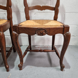 Lovely set of six French oak rush seated provincial dining chairs. They have been sourced from France and are in good detailed condition.