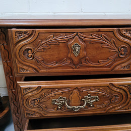 French Cherrywood Louis XIV style wooden topped chest of four drawers. It has been sourced from France and is in good original detailed condition.