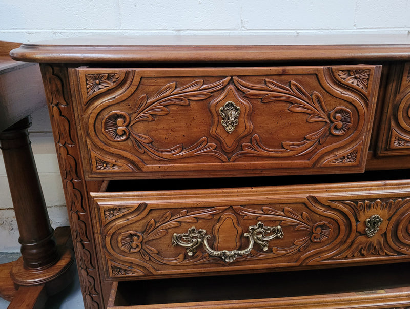 French Cherrywood Louis XIV style wooden topped chest of four drawers. It has been sourced from France and is in good original detailed condition.