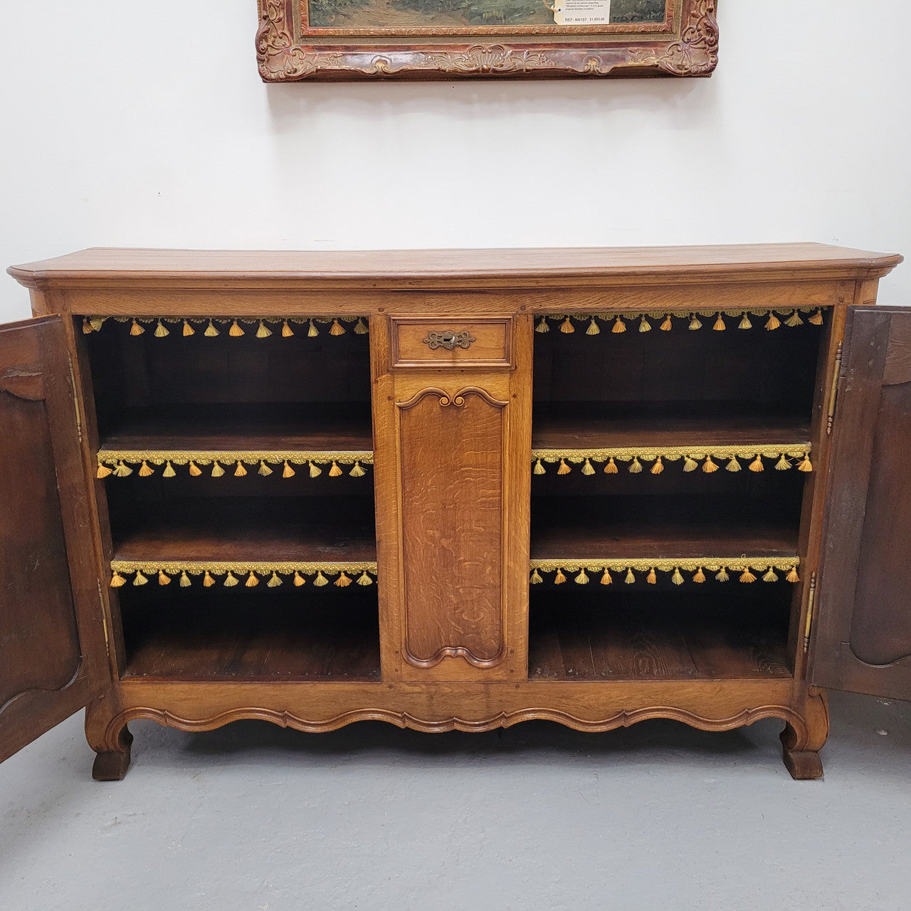 Amazing French Oak early 19th Century two door sideboard with one drawer and two fixed shelves. Sourced from France and in good original detailed condition.