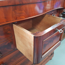 Victorian Flame Mahogany chest of eight drawers. Wooden handles with inlaid mother of pearl, hat drawer has key and lock that works. In good original condition, all drawers run smoothly.