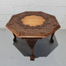 Heavily carved Teakwood round Chinese coffee table. In good original detailed condition. Circa: 1920
