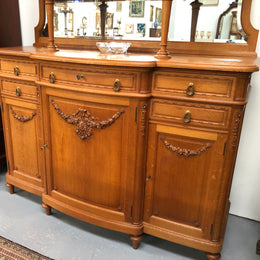 French Oak parquetry top sideboard with a glass top section for displaying and three cupboards and drawers for all your storage needs. Lovely carved details and is in good original detailed condition.
