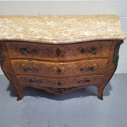 French three drawer marquetry inlaid marble top commode with decorative ormolu mounts. In good original detailed condition.