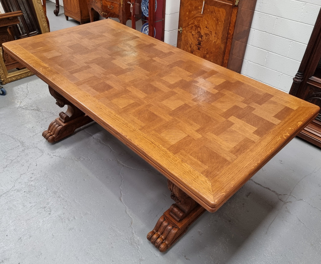 Amazing French Oak Renaissance style parquetry top extension table. Beautiful parquetry top and amazing detailed carvings on the legs. It extends to 306 cm long when fully extended. Sourced from France and in good original detailed condition.