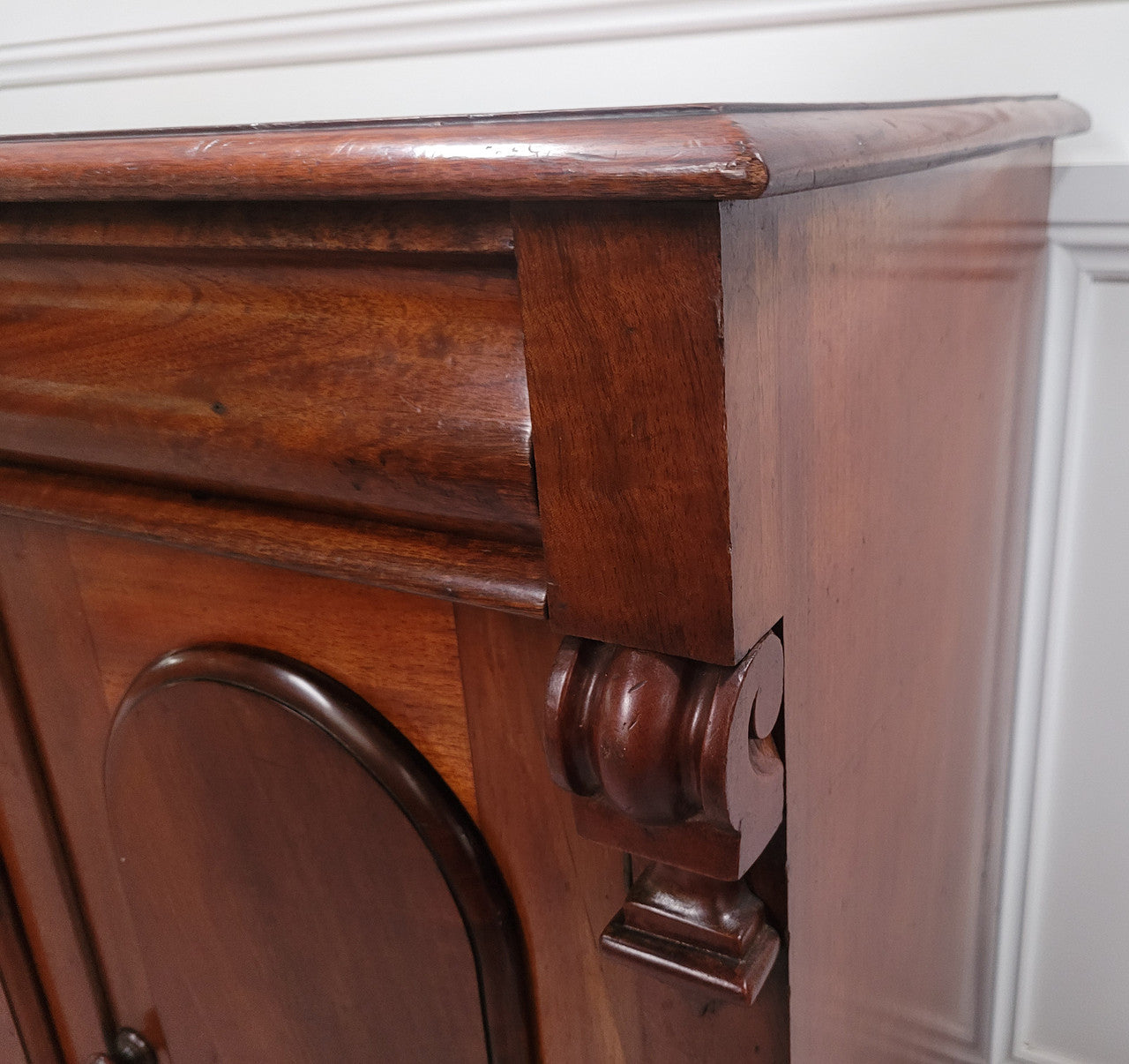 Cedar side cabinet with two doors one drawer and lovely door panels and corbels. It has been sourced locally and is in good original detailed condition.