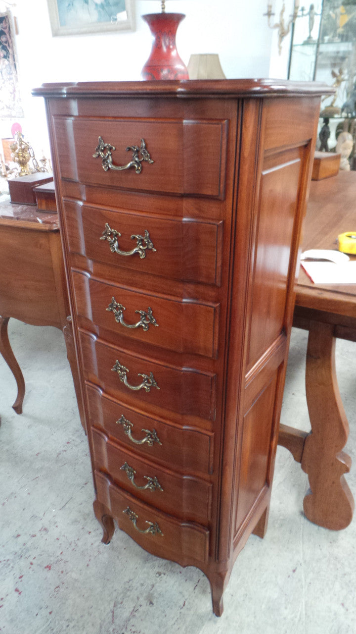 A fabulous petite French Louis XVI style, cherrywood seven drawer semainier. In very good condition.