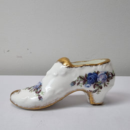 A lovely pair of Royal Albert China shoes in good original condition. Stamped on the sole 'Moonlight Rose: Royal Albert Bone China, England ©1987.