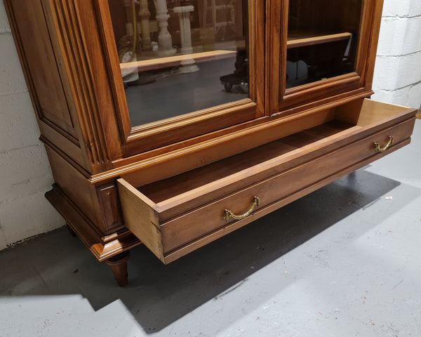 Stunning French Henry II style Walnut two door bookcase. In good original detailed condition.