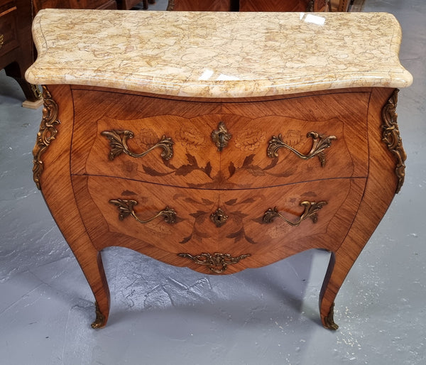 Fabulous French petite inlaid two drawer commode with ormolu mounts and lovely marble top. It is in good original detailed condition.
