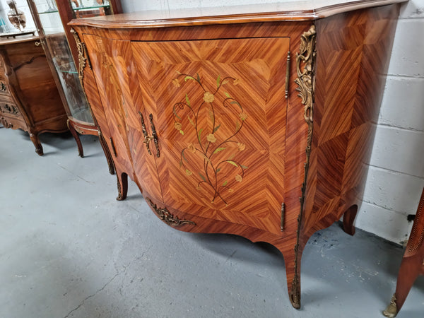 A high quality Louis XV style Kingwood marquetry inlay cabinet. Features extensive inlay inside the doors, and has beautiful ormolu mounts. In good original detailed condition.