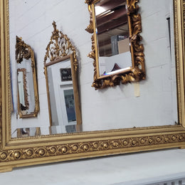Impressive French Napoleon III water gilded mantle mirror. It is beautifully decorated with allegorical themes and has been sourced from France. In good original detailed condition with original mirror.