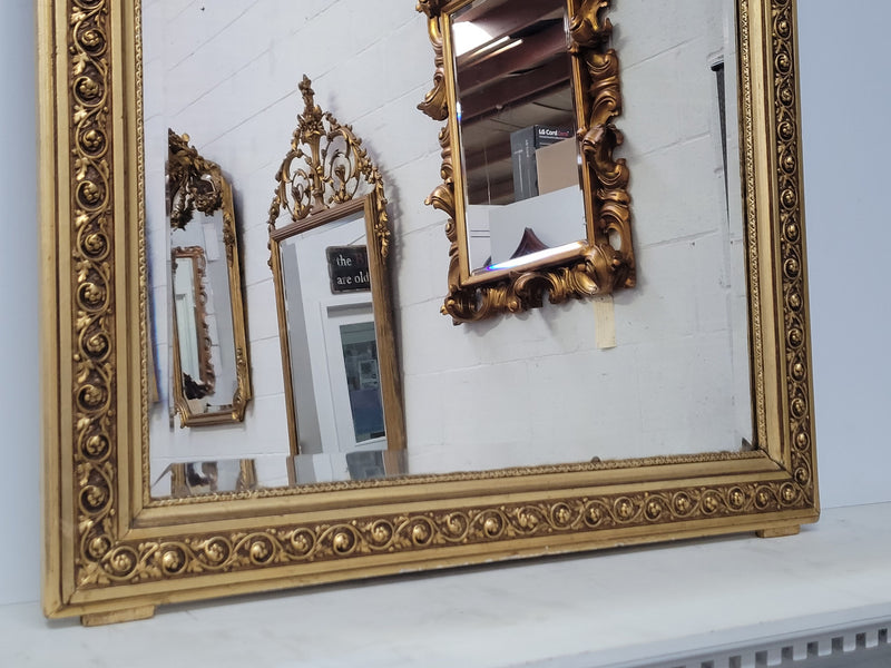 Impressive French Napoleon III water gilded mantle mirror. It is beautifully decorated with allegorical themes and has been sourced from France. In good original detailed condition with original mirror.