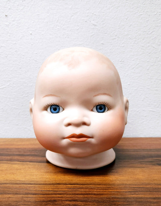 Large Bisque Dolls Head with beautiful blue eyes.  Marked on the back of the neck "Copy By Grace S utnam Made in Germany"  no chips or cracks please see photos as they form part of the description.