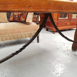 French Oak Spanish style dinner table with beautiful simple iron work underneath. Table top is in good original condition with character marks and has a wax finish. Circa 1930.