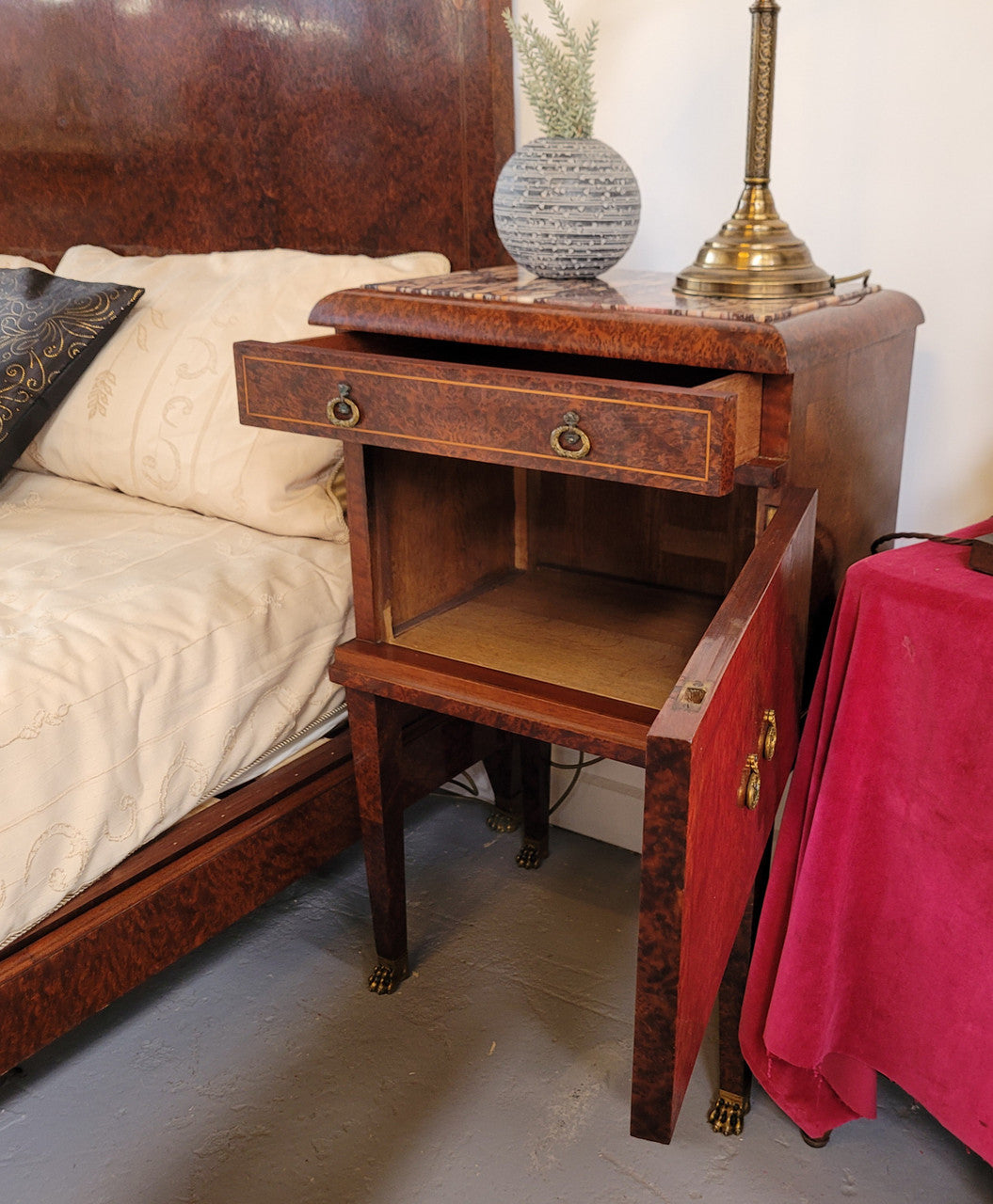French Art Deco bedroom suite consisting of queen size bed in Amboyna wood and featuring pretty inlay. It comes with a matching pair of bedsides. It is a very stylish and high quality suite. It has been sourced from France and is in good original detailed condition.