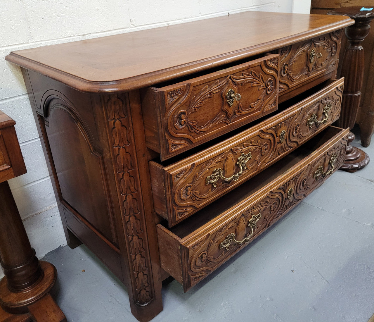 French Cherrywood Louis XIV style wooden topped chest of four drawers. It has been sourced from France and is in good original detailed condition.