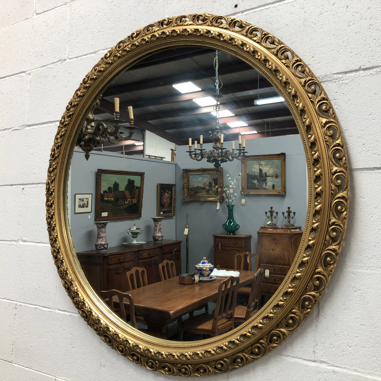 Decorative round gilt wall mirror.