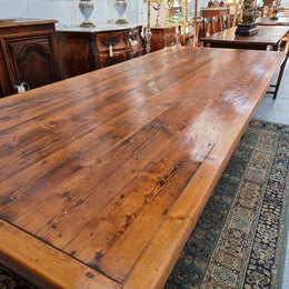 Reclaimed Pine and Oregon stretcher base dining table. The top has an amazing patina and character. Can very comfortable seat 12 and is in good original detailed condition .