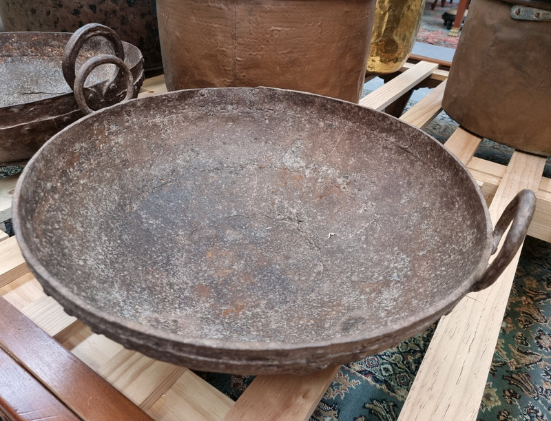 Early 19th Century rustic cast iron handled pan with a rich patina. It is in good original condition.