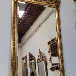 Impressive French Napoleon III water gilded mantle mirror. It is beautifully decorated with allegorical themes and has been sourced from France. In good original detailed condition with original mirror.
