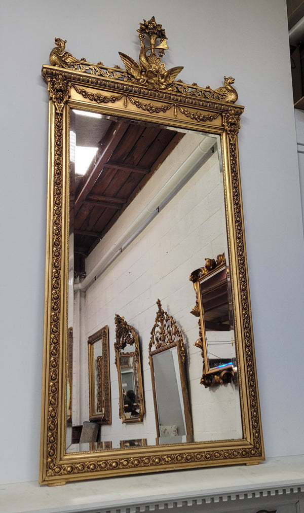 Impressive French Napoleon III water gilded mantle mirror. It is beautifully decorated with allegorical themes and has been sourced from France. In good original detailed condition with original mirror.