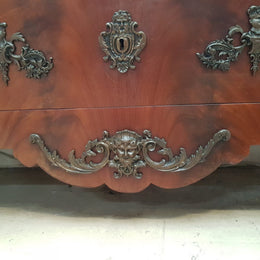 A Grand French Louis XV Style Flame Mahogany Commode