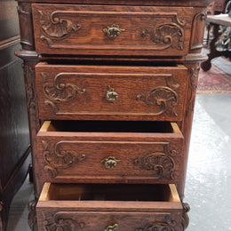 A pair of hard to find French Oak Louis XV style four drawer marble topped bedsides with attractive carvings. They are in good original detailed condition and have been sourced from France.