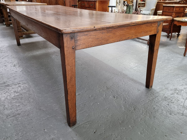 Amazing 19th Century French Oak Farmhouse style dining table with three drawers. It is made from three large planks of wood which is very hard to find. It is also very wide with a width of 105.5 cm. It is in good original detailed condition.