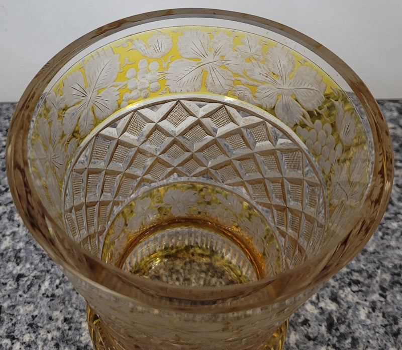 Antique Amber Bohemian acid etched and wheel engraved crystal vase. It has a stunning frieze of vine branches and a star cut base. It is in good original condition, please view photos as they help form part of the description.