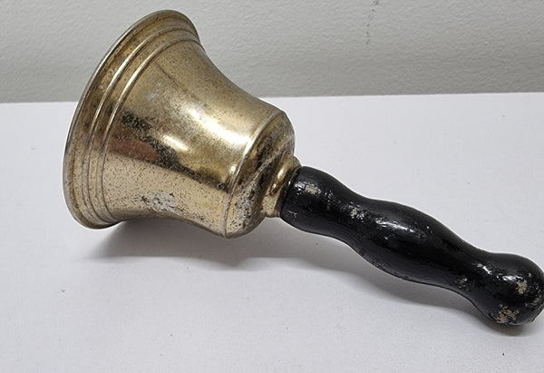 Wooden handled brass bell. It is in good original condition and has been sourced locally. Please view photos as they help form part of the description.