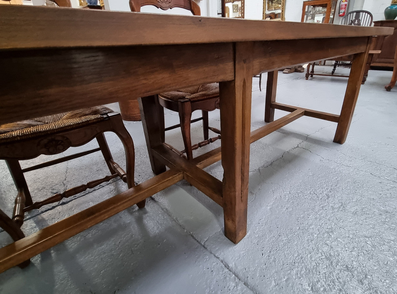 Fabulous French Cherrywood farmhouse dining table with a stretcher base and would easily sit 10 people comfortably in fantastic condition.