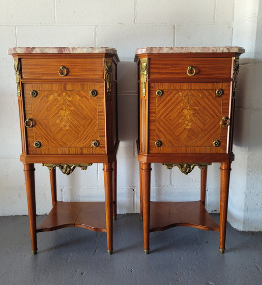 Pair of Louis XVI style Mahogany marquetry inlaid marble top bedside cabinets. Circa 1900 and in good original condition.