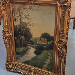 Lovely signed landscape river scene oil on canvas framed in a beautiful ornate frame and in good original condition.