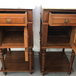 A lovely pair of French Oak, marble top bedside cabinets with a cupboard and drawer in good original condition.