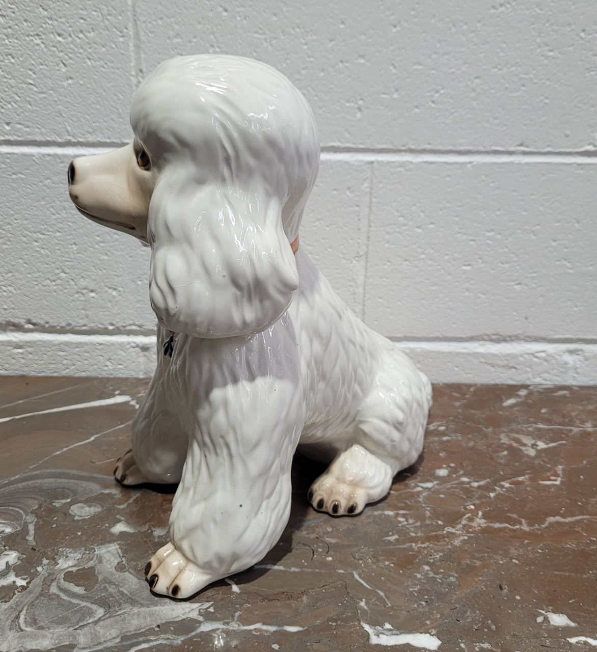 Vintage Italian ceramic Poodle figurine. It is beautifully detailed and in good original condition with no chips or cracks does have crazing to glaze.