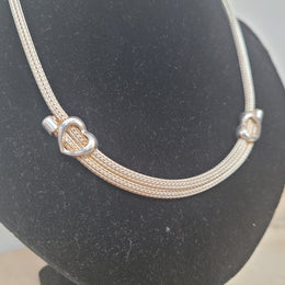 Beautiful Italian sterling silver woven double heart necklace. In good condition.
