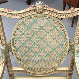 Painted French Louis XVI style cane panel arm chair. Paint is original and it is in very good original condition.