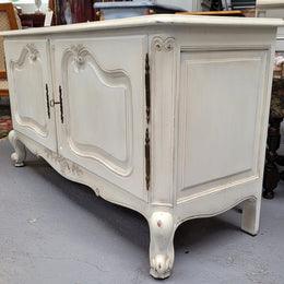 Louis XV style chalk painted two door cabinet which would also make an ideal TV cabinet. It has been sourced from France and in good original detailed condition.