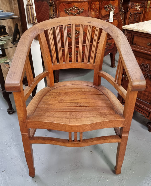 Vintage teak "Captains Chair". It is well built and very comfortable to sit in. It is in good original detailed condition.